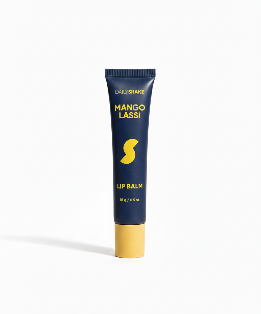 Lip balm tube labeled 'Mango Lassi' on a white background
