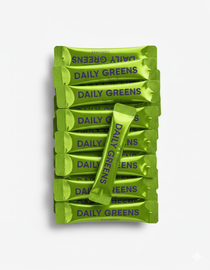 Multiple packages of 'Daily Greens' on a white background