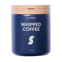Blue container of DailyShake Whipped Coffee with a beige lid on a white background